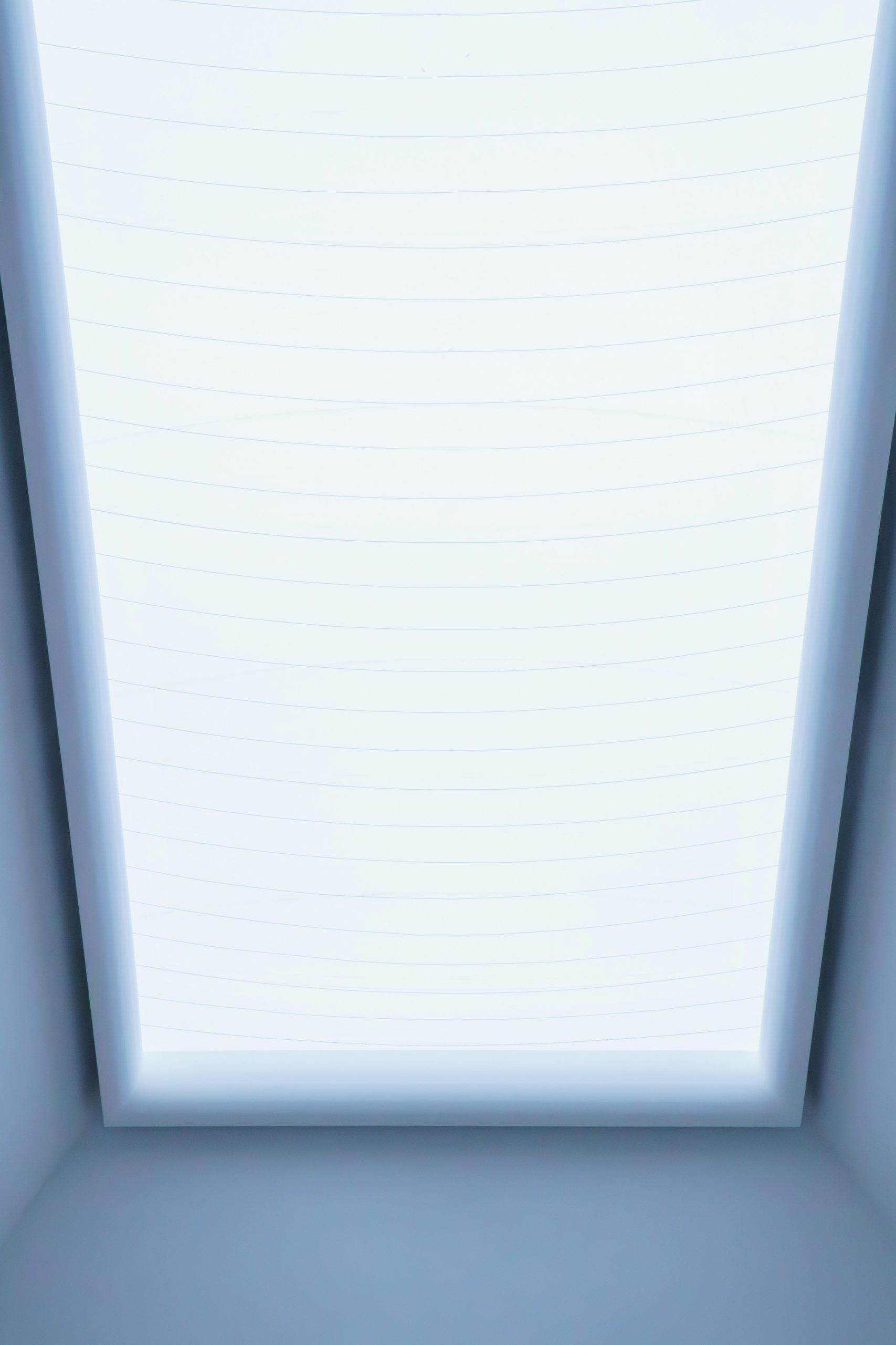 Laptop on a desk displaying a dashboard with graphs regarding energy savings and invoices