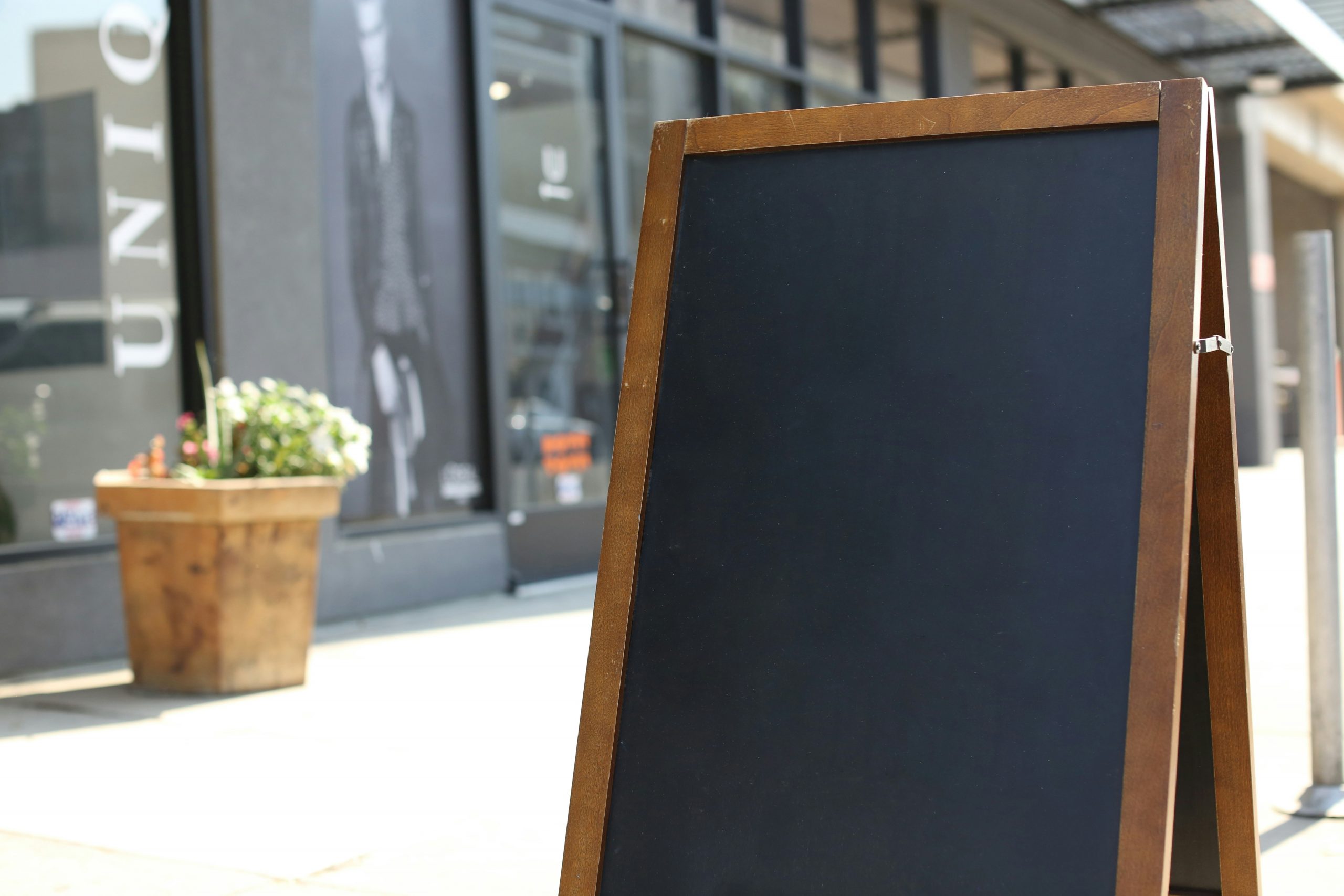 Group of construction workers looking at a tablet showing a dashboard outdoors