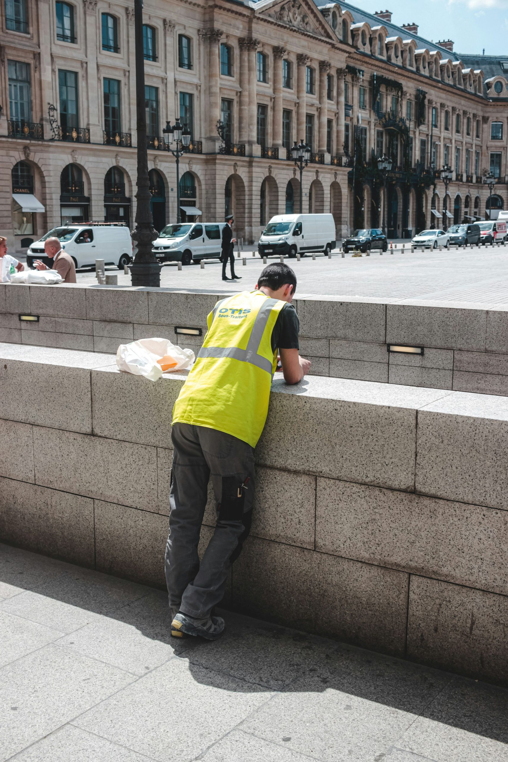 Construction worker using a tablet on a renovation site to check document compliance