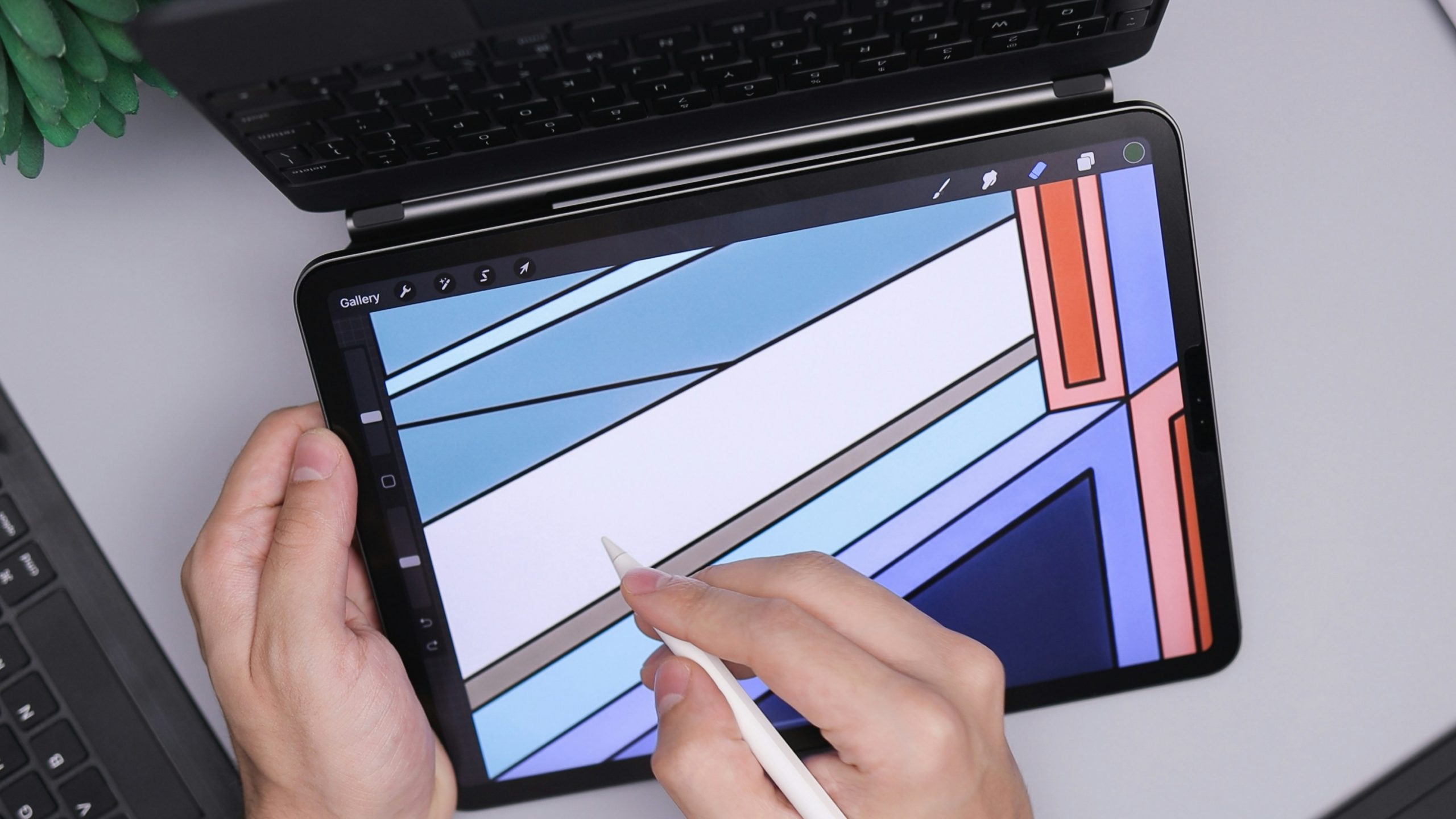 Close up of hands using a laptop showing construction blueprints and digital charts