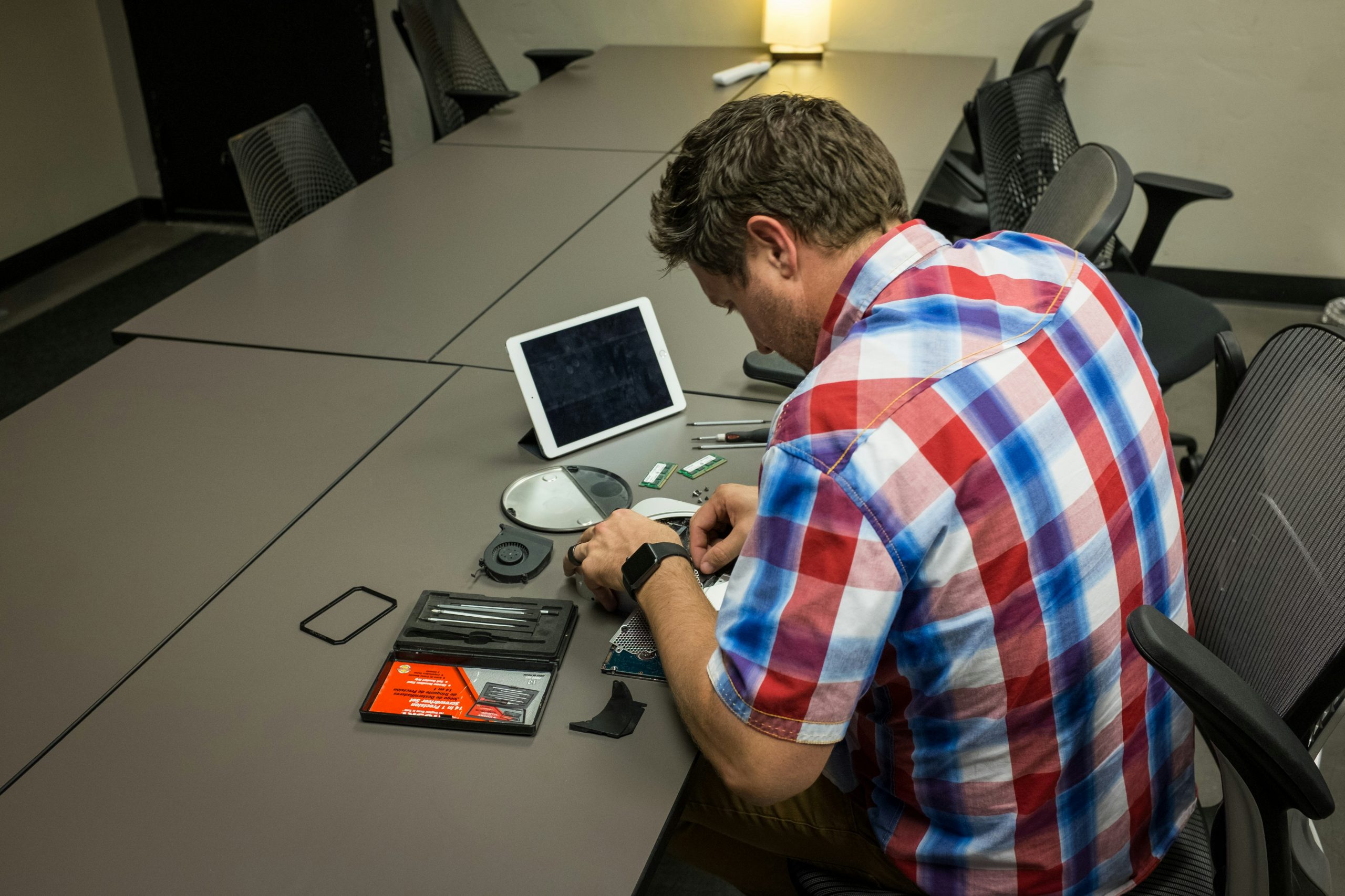 Consultant working on a laptop in a modern office looking at thermal imaging data