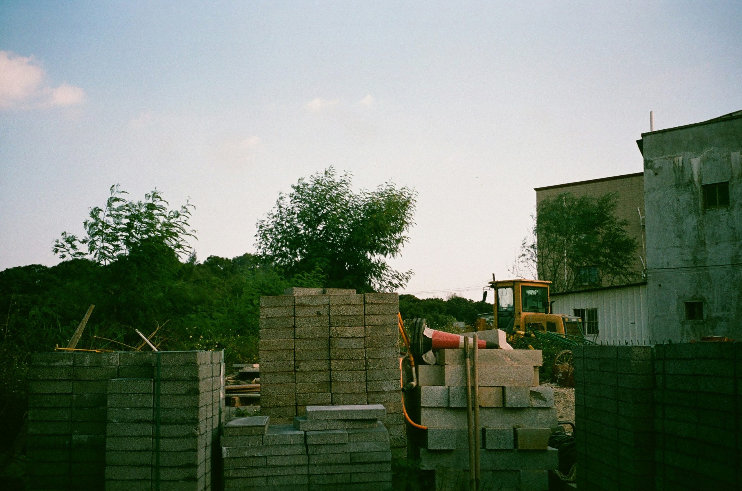 Stacks of bricks and cement bags in a warehouse, symbolizing stock management challenge