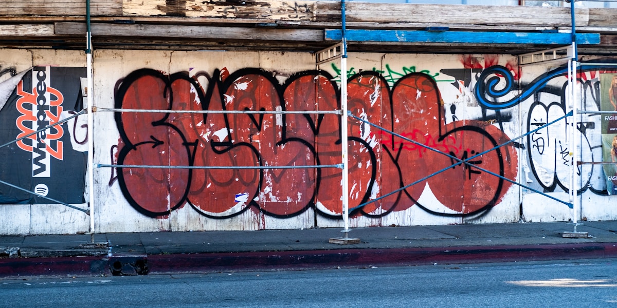 Red graffiti art on a white wall