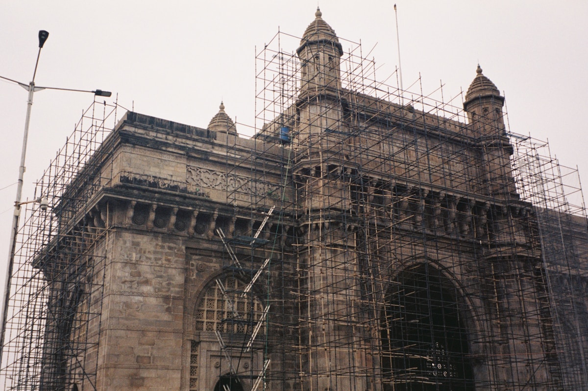 Gateway of india covered in scaffolding.