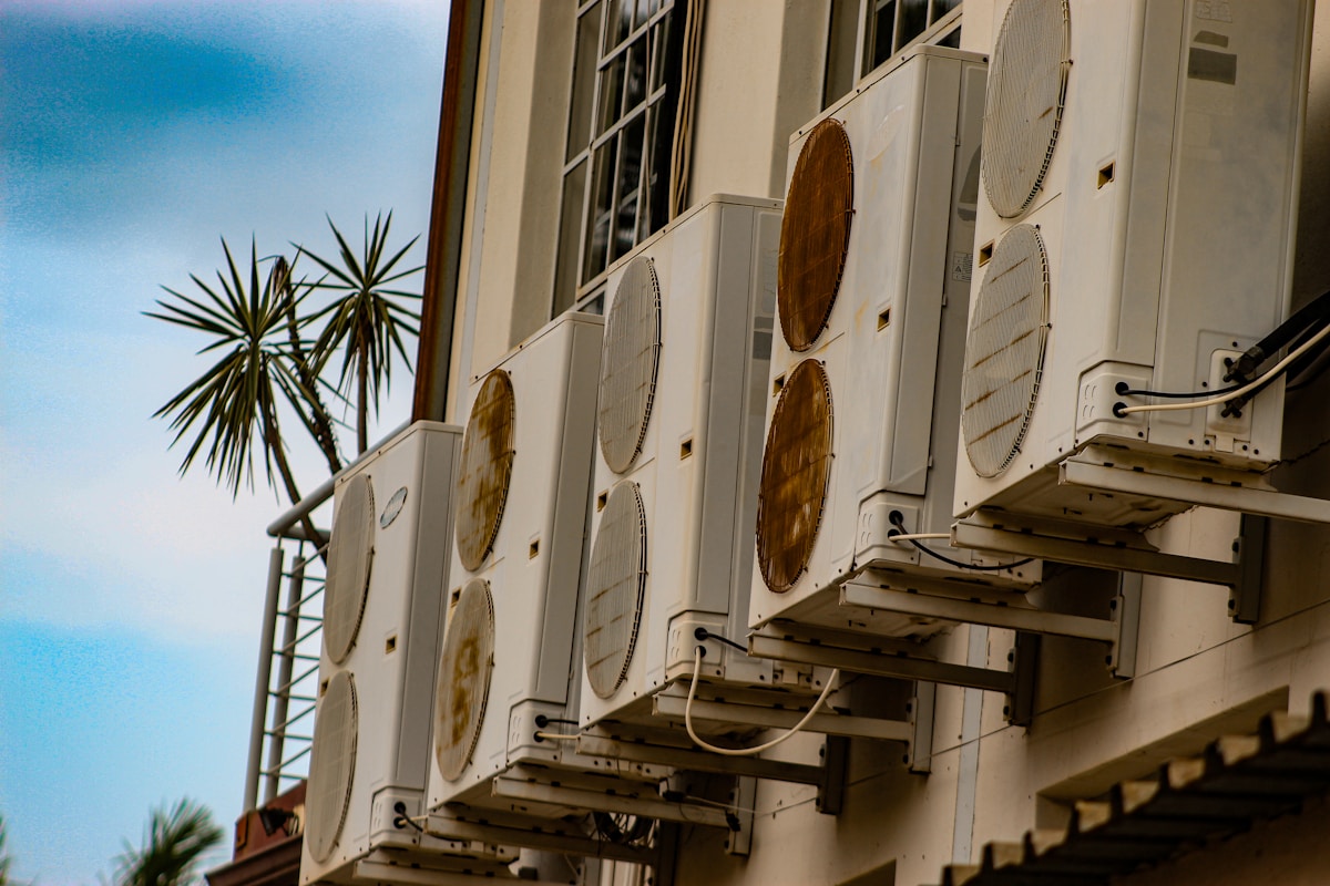 Multiple air conditioning units mounted on a building.